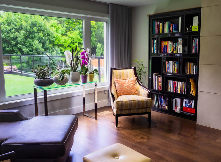 Custom Library / Home Office / Den Room Addition with bookshelves, fireplace, and hardwood flooring.