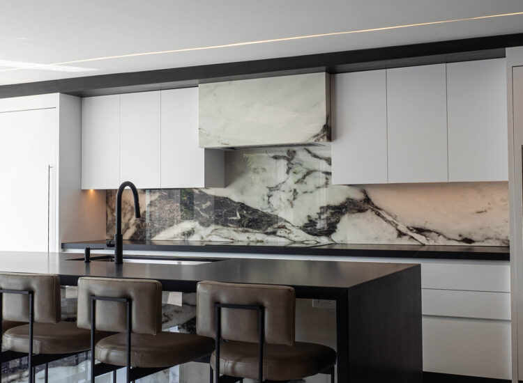 Rivera-Construction-Kitchen-Bar Custom Kitchen Construction with marble backsplash, white cabinetry, and large bar style island
