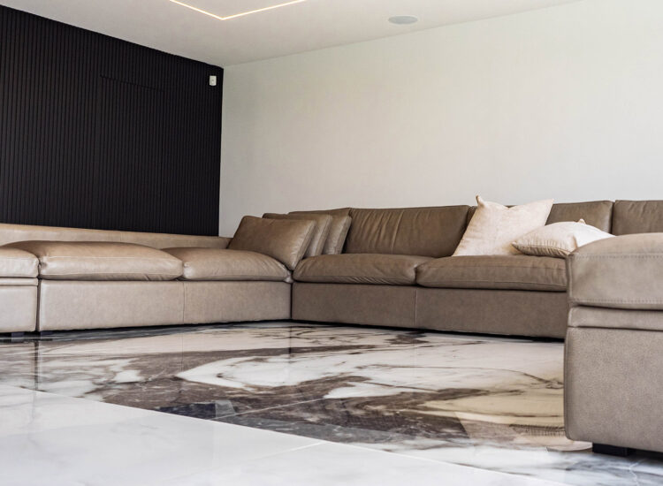 Custom construction of marble floor living room with custom LED lighting in ceiling and slat accent wall