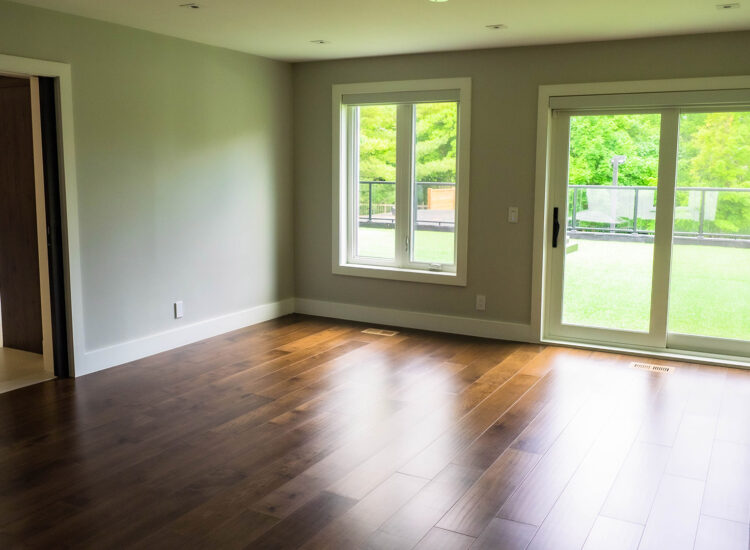 Small atrium room leading to large second floor balcony overlooking the backyard