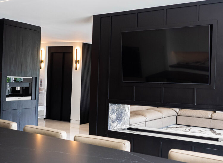 Entertainment wall custom construction with large television and fireplace